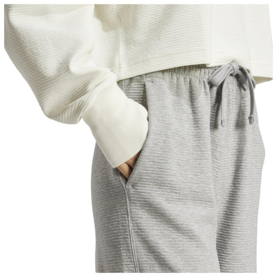 Adidas Γυναικείο παντελόνι φόρμας All SZN Rib 7/8-Length Wide-Leg Pants Adidas Γυναικείο παντελόνι φόρμας All SZN Rib 7/8-Length Wide-Leg Pants